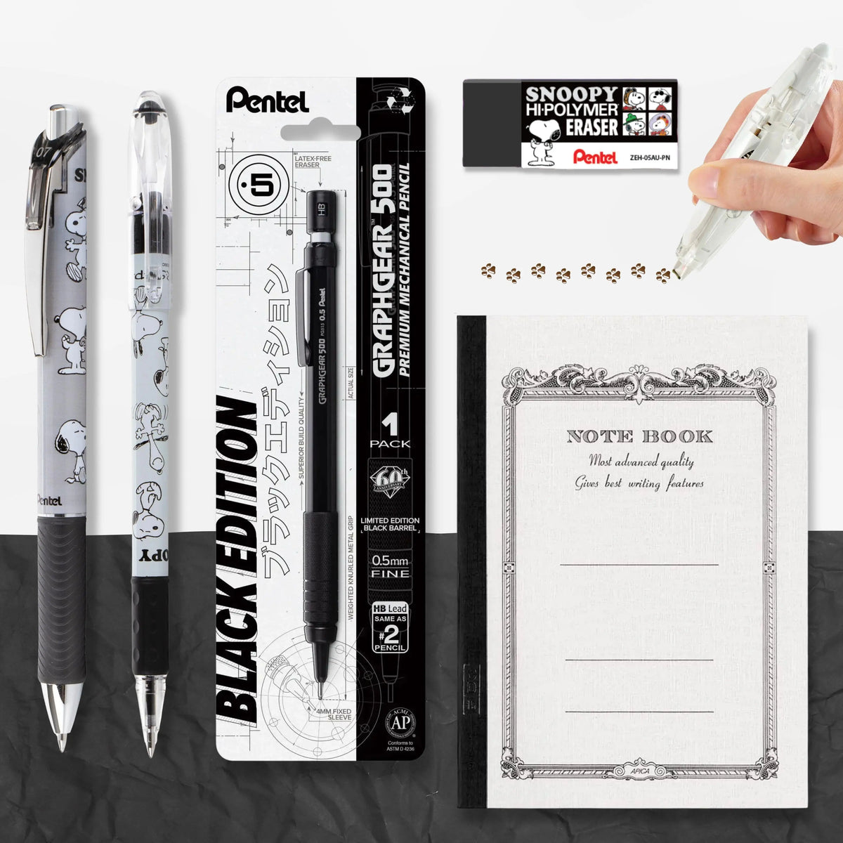 Stationery collage featuring Snoopy pens, a black mechanical pencil, a white writing instrument, pencil marks, and an ornate lined notebook.