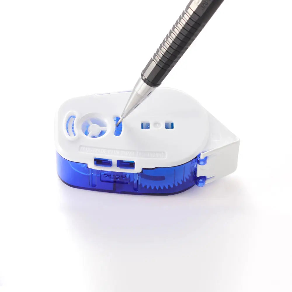 White and blue refillable glue tape dispenser with a pen style applicator tip shown applying permanent adhesive for clean crafting and office projects