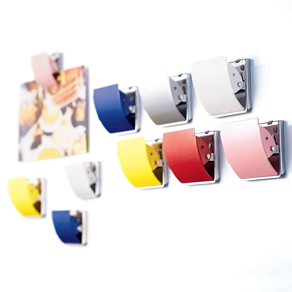 PLUS large extra strong rubber-coated magnet on whiteboard holding papers