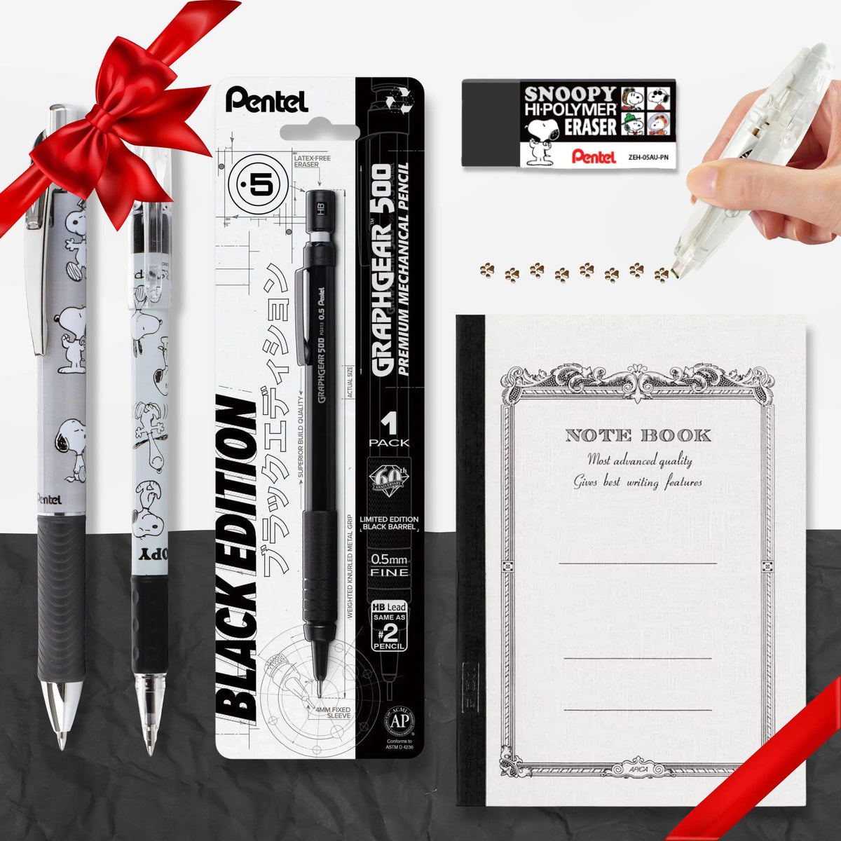 Snoopy themed stationery collage featuring character pens, a mechanical pencil, eraser, ornate note book, and a hand using a white pen to draw paw prints