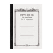 Apica notebook with a white textured cover black spine ornate vintage border NOTE BOOK lettering and ruled writing lines
