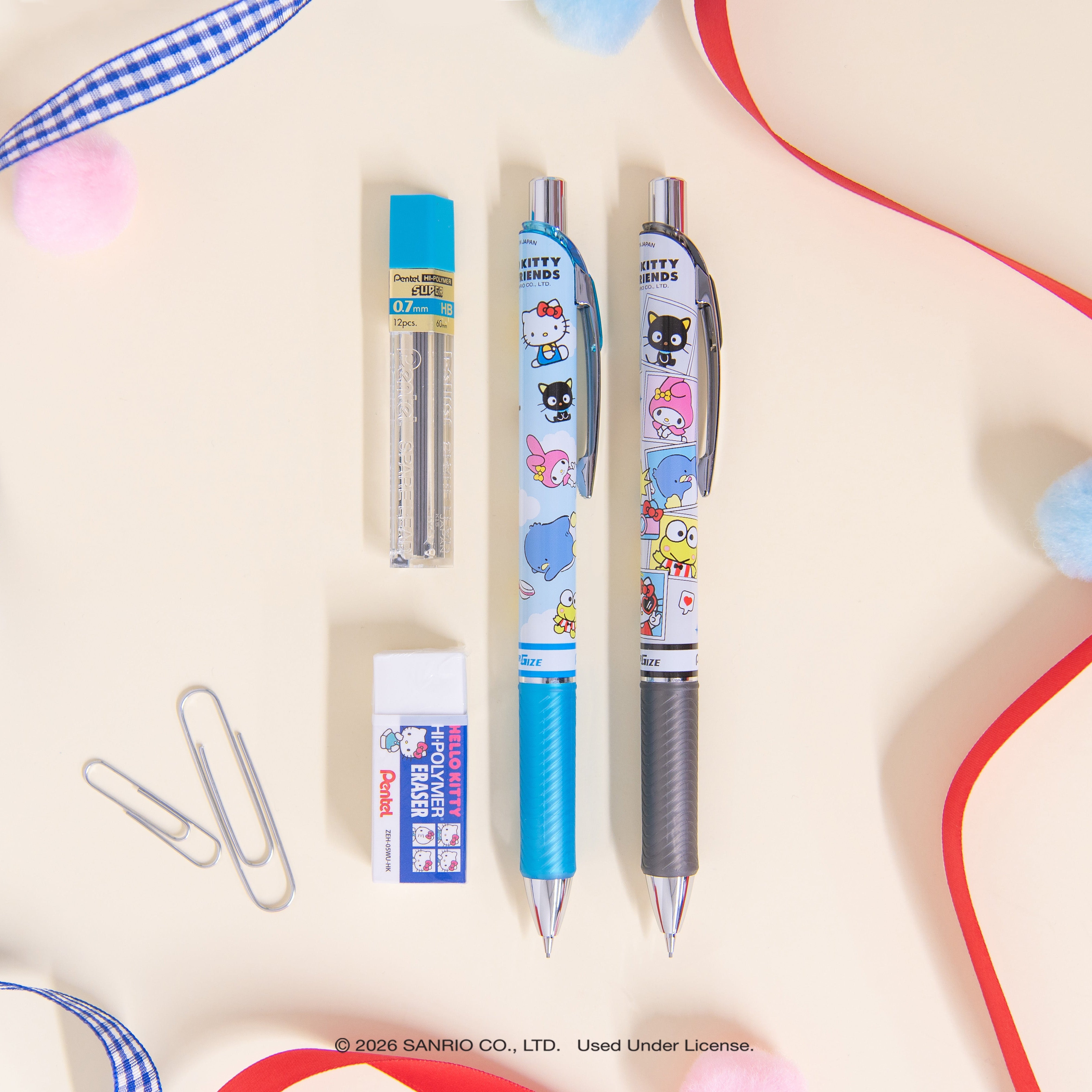 Two pens with cartoon characters, a eraser, and decorative ribbons on a light background