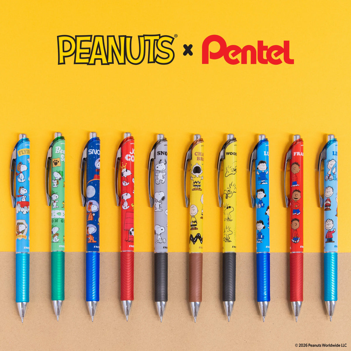 Peanuts and Pentel logos above ten colorful character decorated pens arranged vertically on a yellow and tan background