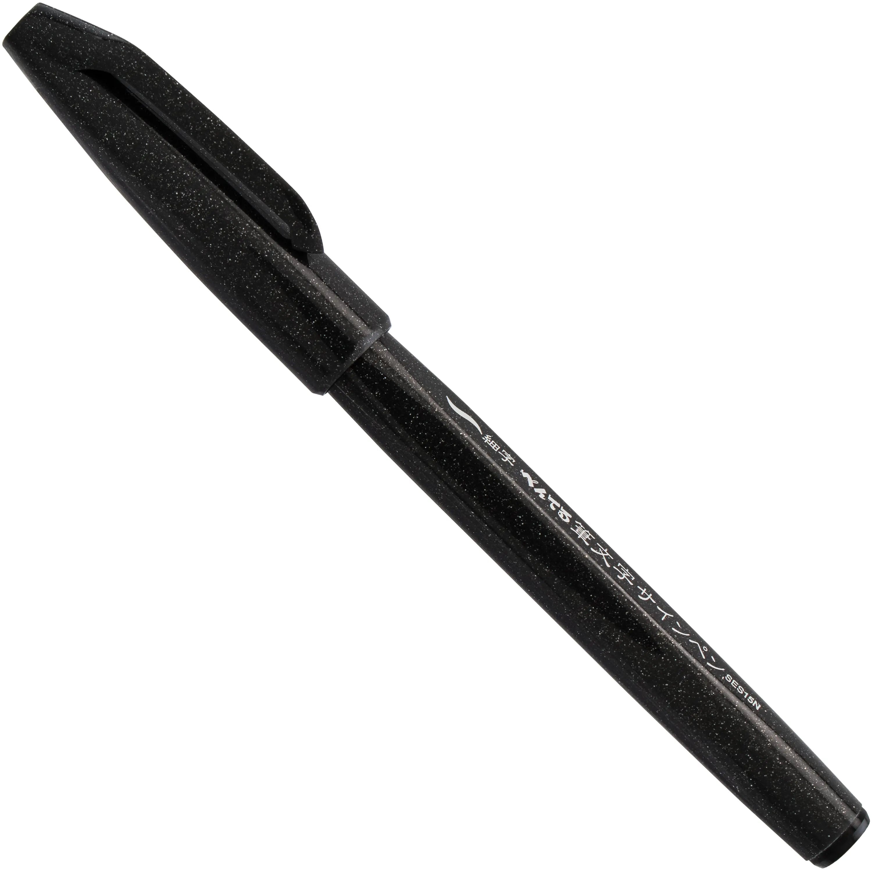 Pentel Arts black brush tip pen shown diagonally on a white background for expressive lettering drawing and other art projects