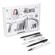 Set of premium black and white pens and mechanical pencils displayed with original packaging featuring artistic designs and handwritten text, ideal for creative journaling.